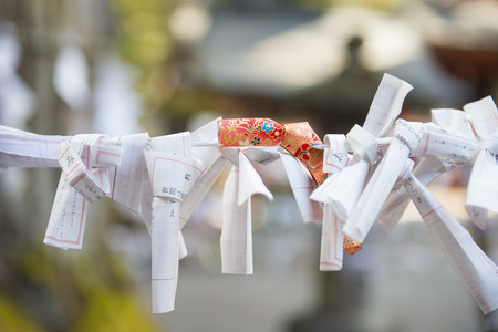 TOKYO, JAPAN - FEBRUARY 17, 2016 : Omikuji :: random fortune papers in shrines at Japan, Esiimsiのeditorial素材
