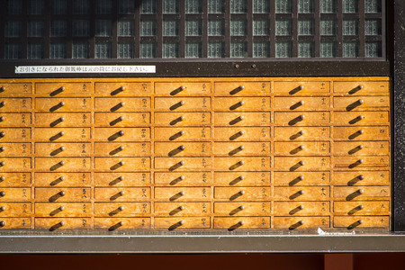 Asakura - Japan , 18 February 2016 :: O-mikuji random fortune paper in box at Asakusa Templeのeditorial素材