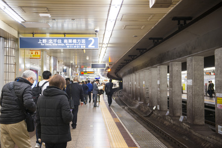 Tokyo, Japan - February 20, 2016 : Passengers waiting for subway in train station, transportationのeditorial素材