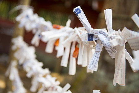 TOKYO, JAPAN - FEBRUARY 17, 2016 : Omikuji :: random fortune papers in shrines at Japan, Esiimsiのeditorial素材