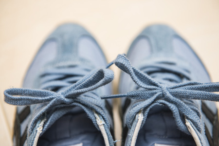 pair of blue sneakers with laces, footwear