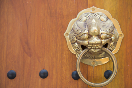 wooden door with antique door knocker, exteriorの写真素材