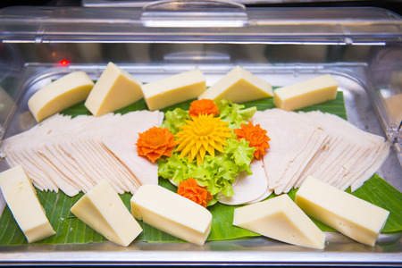 ham slices and cheese on tray, foodの写真素材