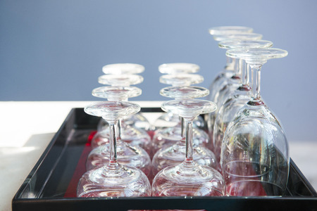 a lot of wine glasses in restaurant, empty