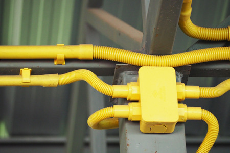 Pipe of electricity line on ceiling in buildingの写真素材