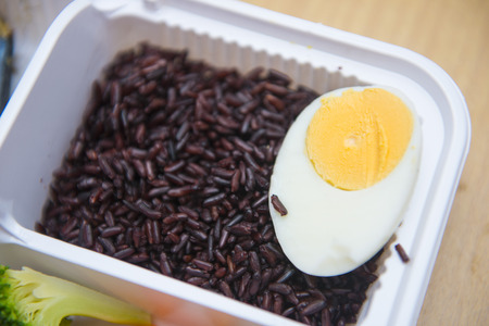 rice berry with boiled egg in plastic box, foodの写真素材