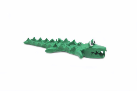 crocodile made by clay on white backgroundの写真素材