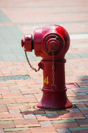 red fire hydrant beside the road in town, safetyの写真素材