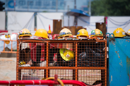 yellow helmet for worker in construction site , hat