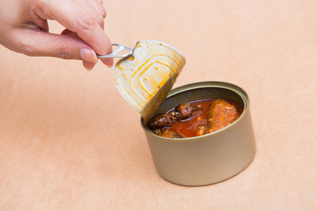 open canned fish by ring pull, canned foodの写真素材