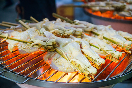 Grilled chicken skewers on stove, foodの写真素材