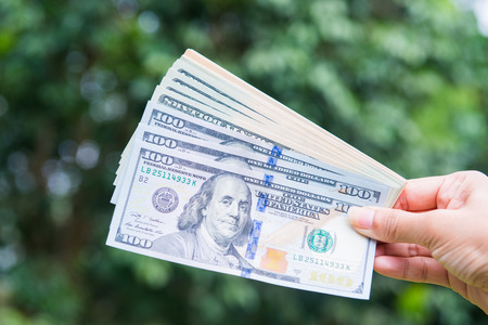 American dollars bank note in hand, cash