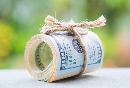 saving money with american dollars , cashの写真素材