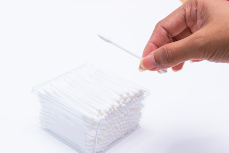 Cotton buds in plastic box isolated on white background, healthcareの写真素材