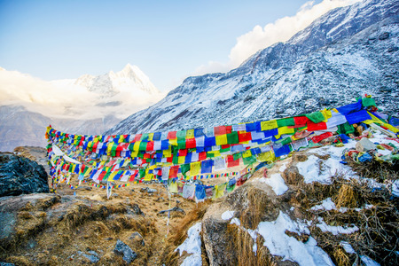 color prayer flags on top of Annapurna base camp , Nepal