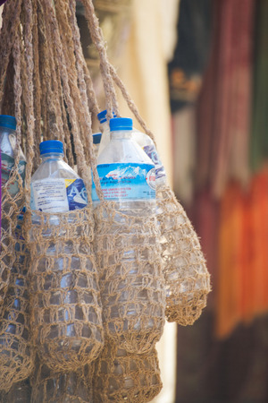 Nepal - 3 January 2017 ::hand made water bottle bag made from sack , Nepalのeditorial素材