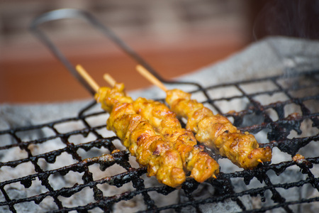 chicken skewers on charcoal grill, foodの写真素材