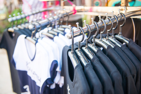 Row of t-shirts in store, clothes