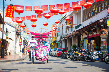 Malacca, Malaysia - February 21, 2016 :Trishaw is popular public transports around the Dutch Square Malacca, Malaysiaのeditorial素材