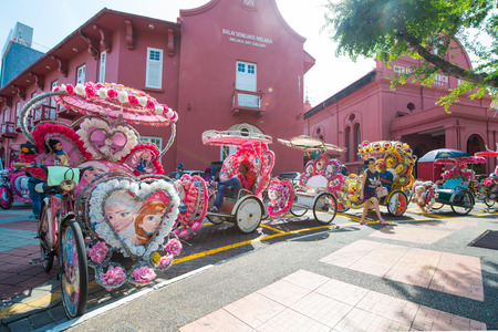 Malacca, Malaysia - February 21, 2016 :Trishaw is popular public transports around the Dutch Square Malacca, Malaysiaのeditorial素材