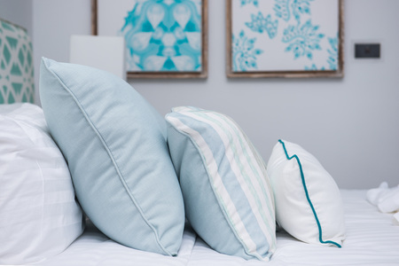 bedroom interior design with comfortable soft pillows on the bedの写真素材