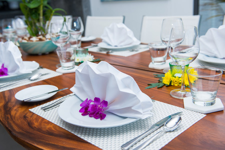Decorated table with white napkin, table settingの写真素材
