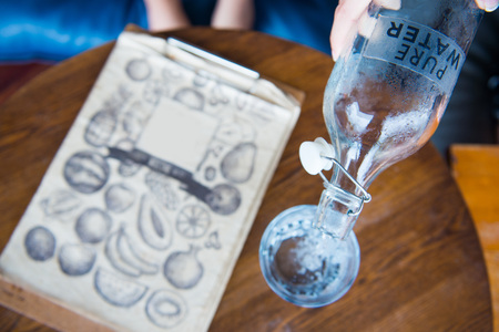 pouring pure water from bottle into glass , drinkの写真素材