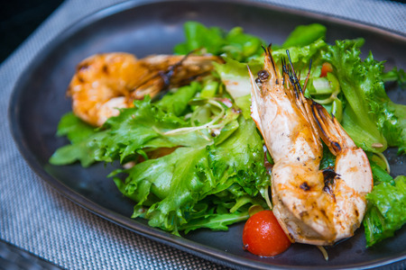 Grilled shrimp salad on plate, foodの写真素材