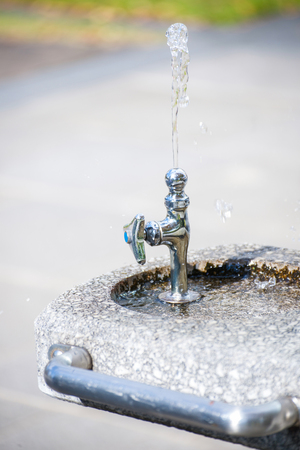 Faucet for drinking in a public park, waterの写真素材