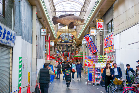 Osaka, Japan - November 19, 2017 :Many tourist at Kuromon Ichiba fish market. The Kuromon Ichiba Market is a large market and most popular in Osaka, Japanのeditorial素材