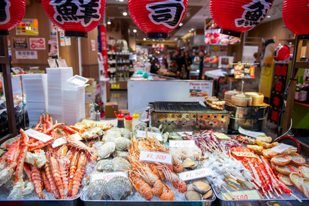 Osaka, Japan - November 19, 2017 :Many fresh seafood at Kuromon Ichiba fish market. The Kuromon Ichiba Market is a large market and most popular in Osaka, Japanのeditorial素材