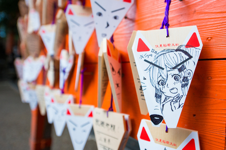 KYOTO, JAPAN - November 15, 2017 : Fox shaped praying cards with blessing text lay at Fushimi Inari Taisha shrine in Kyoto, Japanのeditorial素材