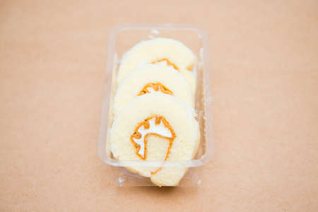 Yam roll cake in plastic box, dessertの写真素材