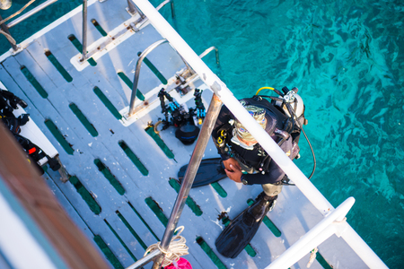 Scuba divers with equipment before diving at Similan Marine National park, Phang-nga, Thailandの写真素材