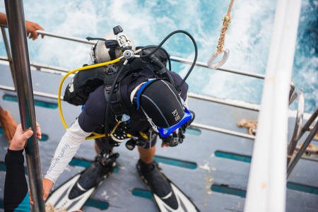 Scuba divers with equipment before diving at Similan Marine National park, Phang-nga, Thailandの写真素材