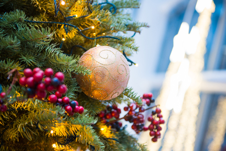 Christmas tree beautifully decorated with glass balls and flashing lightsの写真素材