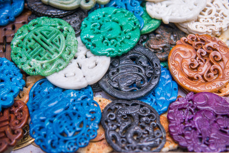 Traditional Chinese stone amulets made of jade at Upper Lascar Row historical market, Hong Kongの写真素材