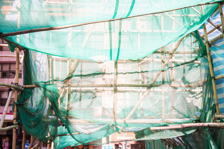 The building during the renovation with scaffolding, constructionの写真素材