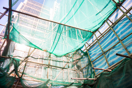 The building during the renovation with scaffolding, constructionの写真素材