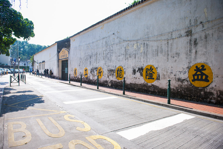 Macau - January 16, 2018 :Yellow bus stop words written on the street at Taipa, macau, Transportationのeditorial素材