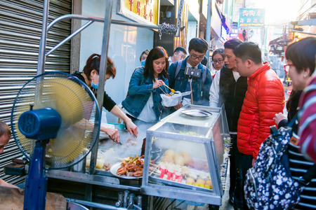 Macau - January 15, 2018 :People waiting buy food at street stalls in Macau, deliciousのeditorial素材