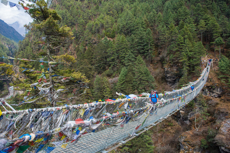 8 April 2018 - Nepal ::trekker cross the river by suspension bridgeの写真素材