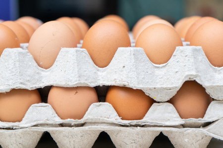 Chicken eggs in paper carton box, fresh raw eggs