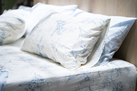 scatter cushion on the bed in bedroom,pillowの写真素材