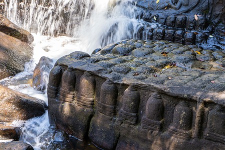 stone carving in the river at Kbal Spean, Cambodiaの写真素材