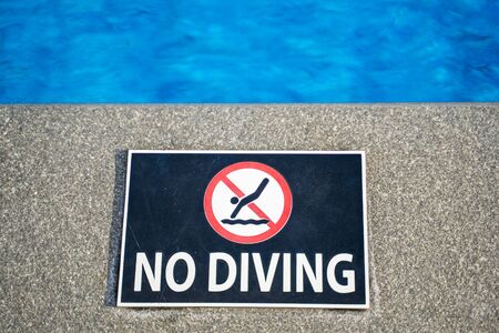 no diving warning sign at swimming pool,poolの写真素材