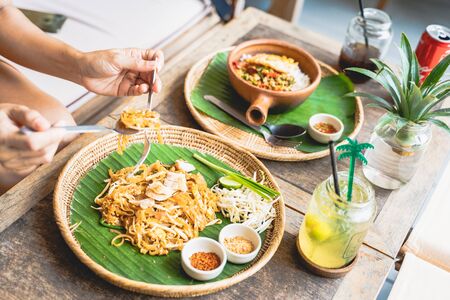 eating Pad Thai at restaurant, Thai foodの写真素材