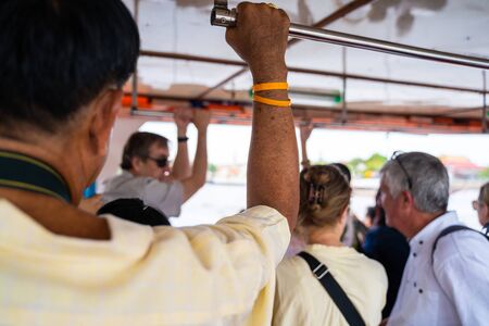 Bangkok, Thailand - 27 july 2019 : tourist hold rail and stand on boat, Thailandのeditorial素材