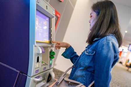 26 September 2019 - Bangkok : woman withdraw money from ATM machine, Thailand