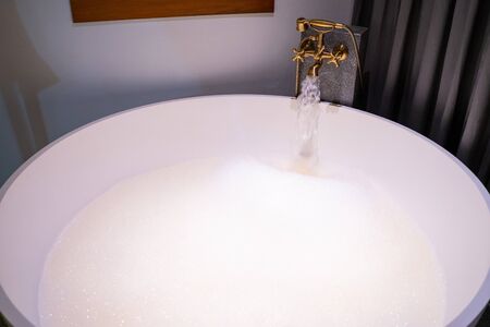 open warm water into bathtub, shower